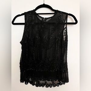 Black sheer beaded dressy top.